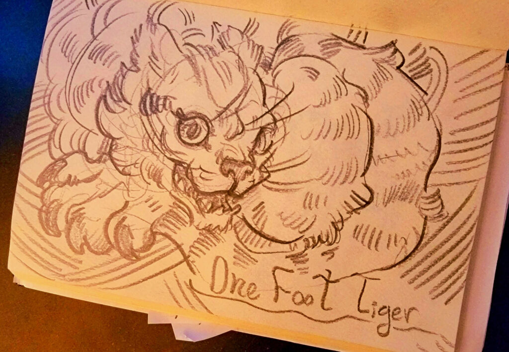 Open sketchbook with a doodle of a scribble tiger, one large paw on display.